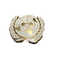 Emblema metalico boina onu blanco